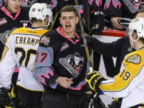 Calgary Hitmen's Jackson Houck yells over at the penalty box after he got the blade of a stick under his visor courtesy of Brandon Wheat Kings Macoy Erkamps in WHL action at the Scotiabank Saddledome in Calgary on Sunday.