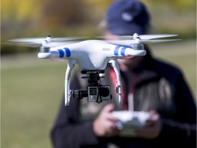 A DJI Phantom II drone flies recreationally in a rural area near Calgary, Alta., on Tuesday, Sept. 22, 2015. Lyle Aspinall/Calgary Sun/Postmedia Network