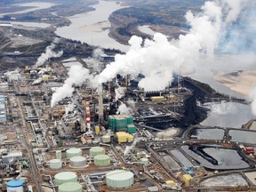 Aerial view of the Suncor oil sands extraction facility near the town of Fort McMurray in Alberta on October 23, 2009. Greenpeace are calling for an end to oil sands mining in the region due to their greenhouse gas emissions and have recently staged sit-ins which briefly halted production at several mines. At an estimated 175 billion barrels, Alberta's oil sands are the second largest oil reserve in the world behind Saudi Arabia, but they were neglected for years, except by local companies, because of high extraction costs. Since 2000, skyrocketing crude oil prices and improved extraction methods have made exploitation more economical, and have lured several multinational oil companies to mine the sands.