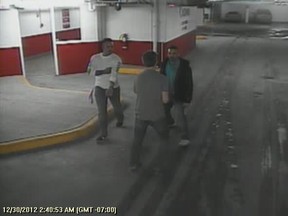 A surveillance camera image used during the trial showing  Addison Hartzler (white shirt), another man and Tyler Kinghorn (back to camera).