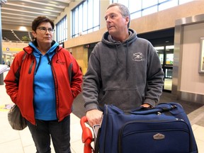 Travellers Sue and Scott Penz say the tanking Canadian dollar won't change their travel plans.