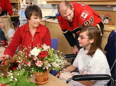 December 22, 2008-  Calgary Flames defenceman Robyn Regehr chats with Alberta Children's Hospital patient Sarah Gregory, 13, and her mother Cathy, of Fort Mcleod, during a visit by Flame's players to the Calgary hospital, Dec. 22, 2008.