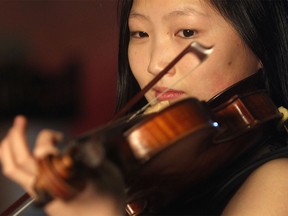 Sixteen-year-old violinist Angela Ryu performs at the Calgary Herald.