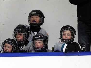 Members of the Symons Valley Novice 3 White team watched from the bench as their goalie made a save during a shootout during Esso Minor Hockey Week.