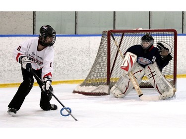 Crew member  Riley Kemp lines up her shot on Ice goalie Jessica Wiebe. The Calgary NW Crew earned a gold medal with an overtime 4-to-3 win over the Saskatoon Ice in the U19A division of the Esso Golden Ring tournament on  Sunday, January 17, 2016.