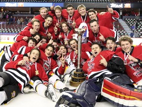 The Calgary Flames midget team celebrate winning the Mac's Midget Boy's Championship game at the Scotiabank Saddledome on New Year's Day.