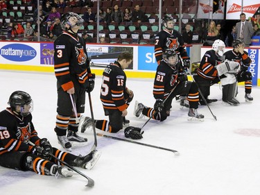 A dejected Lloydminster Pipeline Bobcats team awaits the post game ceremony after losing to the Calgary Flames at the Mac's Midget Boy's Championship game on New Year's Day.