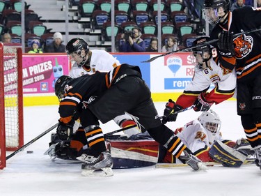 The Lloydminster Pipeline Bobcats score on the Calgary Flames' goalie Adam Marcoux during the Mac's Midget Boy's Championship game at the Scotiabank Saddledome on New Year's Day.