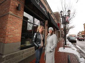 Rebecca O'Brien, Inglewood BRZ director, right, and Liz Tompkins a 25-year resident of Inglewood. stand next to where a Domino's Pizza franchise is set to go in on 9th Avenue, the main drag of the eclectic neighbourhood.