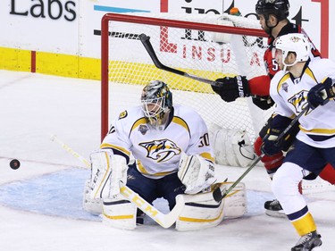 Nashville Predators  goaltender Carter Hutton stops this scoring chance during the second period of NHL action at the Scotiabank Saddledome on Wednesday January 27, 2016.