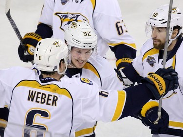The Nashville predators celebrate Shea Weber's goal during the second period of NHL action against the Calgary Flames in Calgary on Wednesday January 27, 2016. Nashville won the game 2-1.