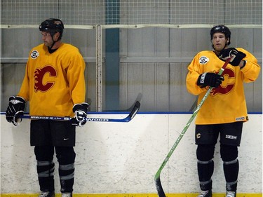 SEPTEMBER 15, 2005: Brothers Robyn Regehr (left) and Ritchie Regehr hit the ice for practice with the Calgary Flames Wednesday morning at the Don Hartman Arena.