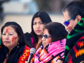 Valerie McMaster, centre, speaks at the Justice for Colton Crowshoe rally with the aim to send a message to her grandson's killers at the Abbeydale Community Centre in Calgary on Saturday, Jan. 23, 2016.