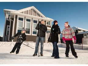 Chad and Pamela Goll along with their children Charles and Madison enjoying their backyard rink in Langdon.