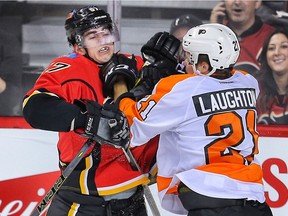 Derek Grant battles against Scott Laughton of the Philadelphia Flyers during a November game.  Grant, who is currently playing with the Calgary Flames' farm team, the Stockton Heat, is off to the American Hockey League all-star game.