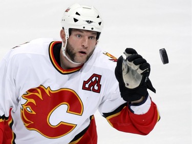 JANUARY 20 2007:  Robyn Regehr #28 of the Calgary Flames grabs the puck out of the air in first period action against the Edmonton Oilers.