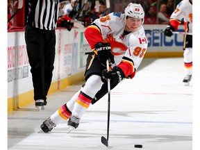 Sam Bennett #93 of the Calgary Flames takes the puck in the third period against the New Jersey Devils on January 19,2016 at Prudential Center in Newark, New Jersey.