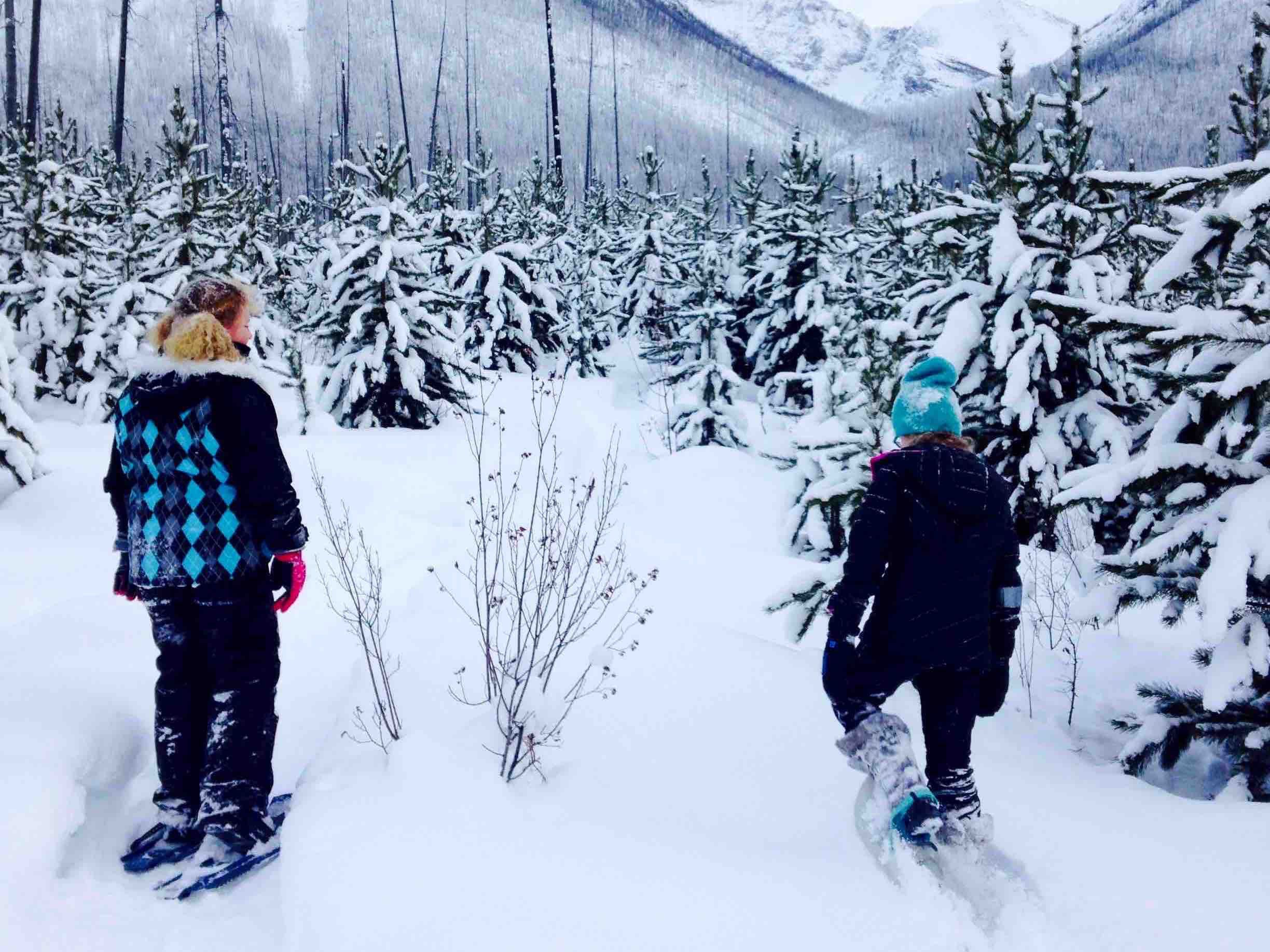 two girls snowshoeing