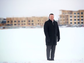 Chris Elkey, senior director of real estate for Canada Lands Company poses for a photo in the area which will become multi-family residential buildings in Currie Barracks.