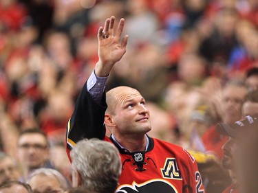 Calgary Flames retired defenceman Robyn Regehr waved to the crowd during a tribute to the longtime Flames player during first period NHL action at the Scotiabank Saddledome on January 11, 2016. Regehr signed a one day contract with the team Monday to be able to officially retire as a Flame and was honoured during the game against the San Jose Sharks.