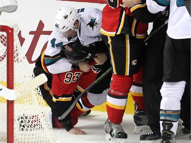 San Jose Sharks defenceman Marc-Edouard Vlasic wrestled with Calgary Flames centre Sam Bennett following the final whistle during NHL action at the Scotiabank Saddledome on January 11, 2016. The Sharks defeated the Flames 5-4.