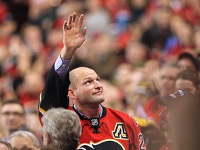 Calgary Flames retired defenceman Robyn Regehr waved to the crowd during a tribute to the longtime Flames player during first period NHL action at the Scotiabank Saddledome on January 11, 2016. Regehr will be paying a visit to Cochrane to meet players and sign autographs for this year's Hometown Hockey Tour.