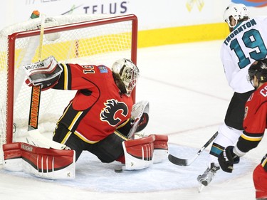 Calgary Flames goalie Karri Ramo looked left as San Jose Sharks centre Joe Thornton slipped the puck through his legs during first period NHL action at the Scotiabank Saddledome on January 11, 2016.