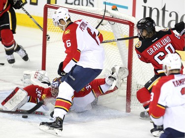 Calgary Flames centre Markus Granlund unleashed a shot on Florida Panthers goalie Al Montoya as defenceman Alex Petrovic provided some support during second period NHL action at the Scotiabank Saddledome on January 13, 2016.