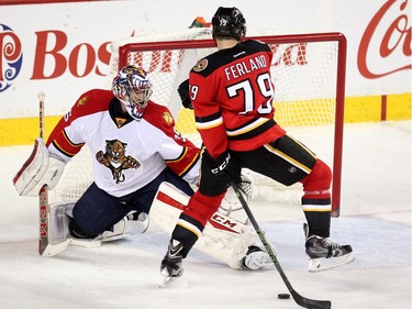 (File photo) Calgary Flames left winger Micheal Ferland tried to shoot the puck from behind his back against Florida Panthers goalie Al Montoya at the Scotiabank Saddledome on January 13, 2016.