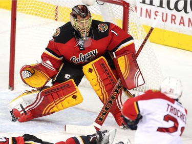 Calgary Flames goalie Jonas Hiller fielded a shot by Florida Panthers centre Vincent Trocheck during first period  NHL action at the Scotiabank Saddledome on January 13, 2016.