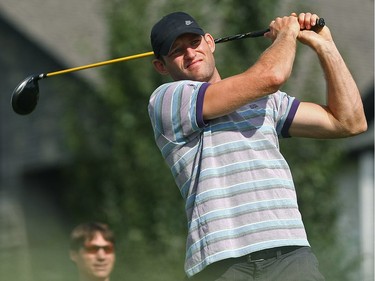 SEPTEMBER 3, 2009-Robyn Regehr eyeballs his drive after teeing off in the annual Calgary Flames Charity Golf Classic September 3 at Country Hill Golf Club.