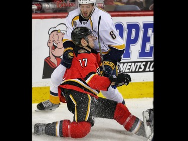 Calgary Flames Lance Bouma collides with Petter Granberg of the Nashville Predators during NHL hockey in Calgary, Alta., on Wednesday, January 27, 2016.