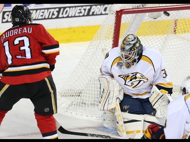 Calgary Flames Johnny Gaudreau rings off the crossbar against Carter Hutton of the Nashville Predators during NHL hockey in Calgary, Alta., on Wednesday, January 27, 2016.
