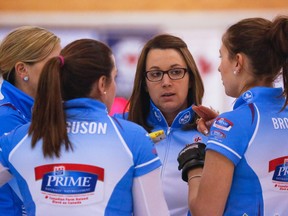 Team Sweeting skip Val Sweeting, centre, talks to her team at the Alberta Scotties Tournament of Hearts at the North Hill Community Curling Club.