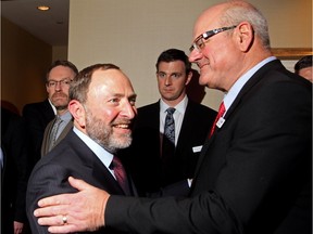 NHL commissioner Gary Bettman shakes hands with Calgary Flames boss Ken King, after a speech urging Calgarians to embrace a proposal for new facilities for the city's pro sports teams.