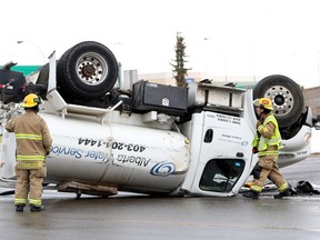 Emergency crews on the scene of a rollover at Ogden Rd and Blackfoot Trail SE in Calgary, Ab., on Saturday, Jan. 30, 2016.