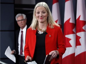 Natural Resources Minister James Carr, left, and Environment Minister Catherine McKenna hold a joint news conference on pipelines in Ottawa on Wednesday.