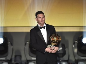 FC Barcelona and Argentina's forward Lionel Messi poses with his trophy after receiving the 2015 FIFA Ballon d'Or award for player of the year on Monday in Zurich, Switzerland. He beat rival Cristiano Ronaldo for the honour.