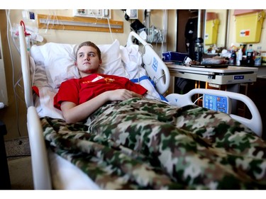 Alex, 15, in his hospital room where he has been since a tobogganing accident on December 21 left him a paraplegic.