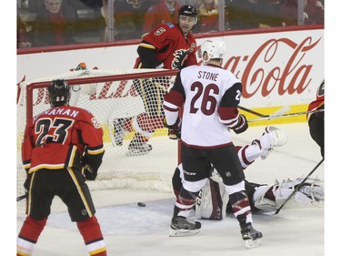 Calgary Flames captain Mark Giordano looks back at Johnny Gaudreau's shoot bouncing out of the net for the first goal of the game during game action against the Arizona Coyotes at the Scotiabank Saddledome in Calgary, on January 7, 2016.