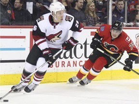 Calgary Flames Micheal Ferland chases down Arizona Coyotes Michael Stone during game action at the Scotiabank Saddledome in Calgary, on January 7, 2016.