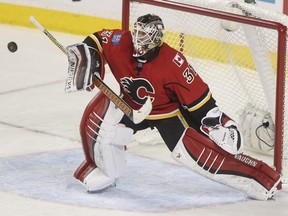 Calgary Flames goalie Karri Ramo makes a blocker save against the Arizona Coyotes on Thursday night.  He survived an injury scare in practice on Sunday.