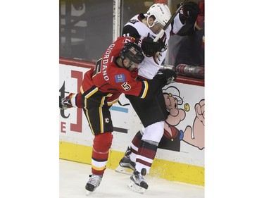 Calgary Flames Mark Giordano gives a little muscle to Arizona Coyote Martin Hanzal during game action at the Scotiabank Saddledome in Calgary, on January 7, 2016.
