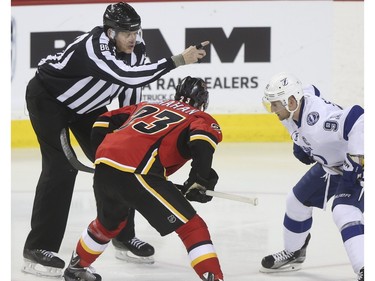 Linesman Mike Cvik at a face off during his last NHL career hockey at the Saddledome in Calgary, on January 5, 2016. Cvik retires after tonights match up between the Calgary Flames and the Tampa Bay Lightning.