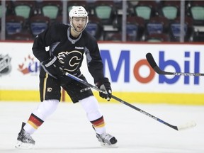 Calgary Flames captain Mark Giordano practises on Sunday at the Saddledome. On Tuesday, he will lead the Flames into the Prudential Center in New Jersey — the scene last season where a biceps injury cost him the campaign and a shot at the Norris Trophy.