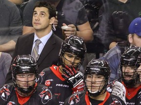 Former Calgary Roughnecks player Kaleb Toth on the bench for the Vancouver Stealth in NLL action at the Scotiabank Saddledome.