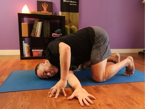 Hart Steinfeld demonstrates the shoulder stretch with a twist pose.