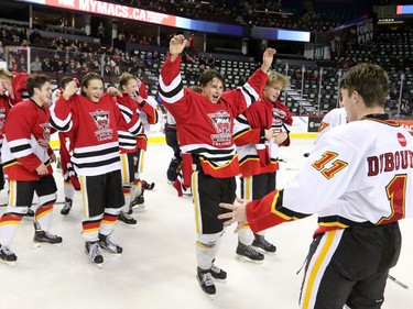 The Calgary Flames midget team celebrate winning the Mac's Midget Boy's Championship game at the Scotiabank Saddledome on New Year's Day.