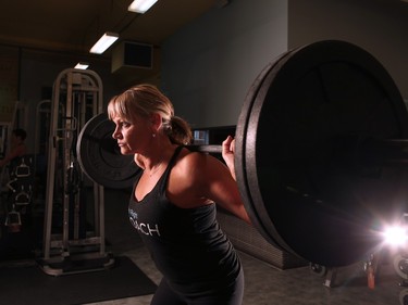 Fitness trainer Helen Vanderburg was photographed doing squats at Heaven's Fitness on Friday January 15, 2016.