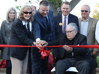 Marg and Ron Southern surrounded by long-time sponsors and supporters cut the ribbon at the opening of the Founders Plaza.